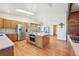 Kitchen features wooden floors, stainless steel appliances, a center island and dining area at 20120 Doewood Dr, Monument, CO 80132