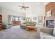 Comfortable living room features a fireplace, neutral tones, and access to the outdoors at 20120 Doewood Dr, Monument, CO 80132