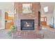 Living room showing fireplace between entry and kitchen at 20120 Doewood Dr, Monument, CO 80132