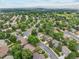 Wide aerial view of the neighborhood with tree-lined streets and well-kept homes at 2013 S Holland St, Lakewood, CO 80227