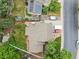 A bird's eye view of a home's backyard featuring a lush yard, patio, and driveway with ample parking at 2013 S Holland St, Lakewood, CO 80227