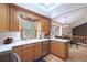 Bright kitchen with white countertops, stainless steel appliances, and a view of the dining area at 2013 S Holland St, Lakewood, CO 80227