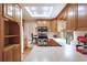 Bright kitchen featuring wooden cabinets, stainless steel appliances, and eat-in dining area at 2013 S Holland St, Lakewood, CO 80227