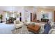 Bright and spacious living room with wood floors and dining area at 2013 S Holland St, Lakewood, CO 80227