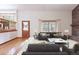 Cozy living room with brick fireplace, built in shelves and plush couches at 2013 S Holland St, Lakewood, CO 80227