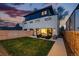 Well-maintained backyard with lush lawn, patio area, and contemporary home exterior at 380 S Humboldt St, Denver, CO 80209