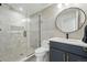 Updated bathroom featuring modern fixtures, tile surround, glass shower, and contemporary vanity at 380 S Humboldt St, Denver, CO 80209