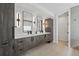 Modern bathroom featuring double vanity, sleek fixtures, and ample storage space with attractive wood grain cabinetry at 380 S Humboldt St, Denver, CO 80209