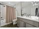Modern bathroom featuring a sleek vanity, large mirror, and stylish shower with decorative tiles at 380 S Humboldt St, Denver, CO 80209