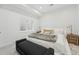 Inviting bedroom with a comfortable bed, bench seating, and cozy, neutral accents at 380 S Humboldt St, Denver, CO 80209