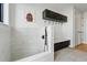 Dedicated dog wash area with tiled shower, built-in bench, and convenient storage solutions at 380 S Humboldt St, Denver, CO 80209