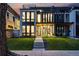 Modern exterior with multi-level decks, lush lawn, and floor-to-ceiling windows offering curb appeal at 380 S Humboldt St, Denver, CO 80209