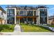 Modern duplex featuring stylish design, large windows, and well-manicured front yard at 380 S Humboldt St, Denver, CO 80209