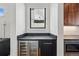 Kitchenette featuring a wine cooler, sleek countertops, and stylish cabinetry at 380 S Humboldt St, Denver, CO 80209