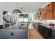 Modern kitchen with large island, stainless steel appliances, and open layout concept at 380 S Humboldt St, Denver, CO 80209