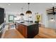 Open kitchen with spacious island, modern appliances, and seamless flow to the living room at 380 S Humboldt St, Denver, CO 80209