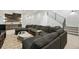 Open-concept living room with an inviting sectional sofa and staircase leading to the upper level at 380 S Humboldt St, Denver, CO 80209