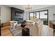 Bright living room featuring a fireplace with large sectional sofa and modern chandelier at 380 S Humboldt St, Denver, CO 80209