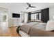 Modern main bedroom with hardwood floors, natural light, and en-suite bathroom at 380 S Humboldt St, Denver, CO 80209