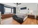 Comfortable main bedroom featuring hardwood floors, natural light, and contemporary furnishings at 380 S Humboldt St, Denver, CO 80209