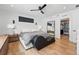 Bright main bedroom featuring hardwood floors, modern decor, and closet at 380 S Humboldt St, Denver, CO 80209