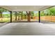 A charming back porch offering an outdoor living space with peaceful views of the backyard at 6526 S Elmwood St, Littleton, CO 80120
