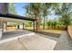 A charming back porch offering an outdoor living space with peaceful views of the backyard at 6526 S Elmwood St, Littleton, CO 80120
