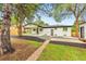 Spacious backyard with patio, lush lawn, and privacy fence perfect for outdoor entertaining at 6526 S Elmwood St, Littleton, CO 80120