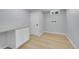 Finished basement with light wood floor, and laundry connections at 6526 S Elmwood St, Littleton, CO 80120