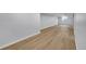Open basement area with sleek flooring and ample space at 6526 S Elmwood St, Littleton, CO 80120