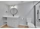 Updated bathroom features new vanity and sink, with modern fixtures at 6526 S Elmwood St, Littleton, CO 80120