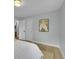 Bright bedroom featuring hardwood floors and white doors at 6526 S Elmwood St, Littleton, CO 80120