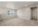 A spacious bedroom with a carpet floor, a window, and recessed lighting at 18122 Tree Sparrow Ave, Parker, CO 80134