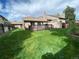 Spacious backyard with lush lawn, a deck for entertaining, and ample space for outdoor activities at 540 S Forest St # A2, Denver, CO 80246