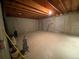 Unfinished basement area with concrete floor and open wood ceiling structure at 540 S Forest St # A2, Denver, CO 80246