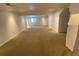 Neutral basement space showcasing carpet flooring, a window, and recessed lighting at 540 S Forest St # A2, Denver, CO 80246
