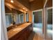 Bright bathroom featuring a double vanity, mirror, and shower at 540 S Forest St # A2, Denver, CO 80246