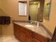 Bathroom with a corner vanity and mirror at 540 S Forest St # A2, Denver, CO 80246