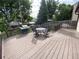 Backyard wooden deck with patio table and chairs, perfect for outdoor entertaining at 540 S Forest St # A2, Denver, CO 80246