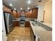 Modern kitchen with stainless steel appliances, granite countertops and wood cabinets at 540 S Forest St # A2, Denver, CO 80246