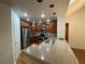 Well-lit kitchen featuring stainless steel appliances, wood cabinets, and granite countertops at 540 S Forest St # A2, Denver, CO 80246