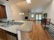 Spacious living room features wood floors, stone fireplace, open to the kitchen area at 540 S Forest St # A2, Denver, CO 80246