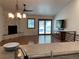 Bright living room featuring wood floors, stone fireplace, sliding door, and ceiling fan at 540 S Forest St # A2, Denver, CO 80246
