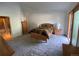Bright main bedroom with a large window and attached bathroom at 540 S Forest St # A2, Denver, CO 80246