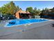 Inviting community pool area with ample seating, lush greenery, and a relaxing atmosphere at 540 S Forest St # A2, Denver, CO 80246