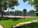 Well-maintained community tennis court surrounded by mature trees and green spaces at 540 S Forest St # A2, Denver, CO 80246