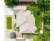 Birds-eye view of a meticulously landscaped property featuring a manicured lawn, patio, and elegant roofline at 1735 Crestone Dr, Longmont, CO 80504
