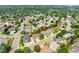 Aerial view of the residential neighborhood showcasing lush greenery and tree-lined streets at 1735 Crestone Dr, Longmont, CO 80504