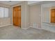 Finished bedroom features carpet, closet space, and a door into another room at 1735 Crestone Dr, Longmont, CO 80504