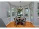 Charming breakfast nook with a stylish round table, metal chairs, and ample natural light at 1735 Crestone Dr, Longmont, CO 80504